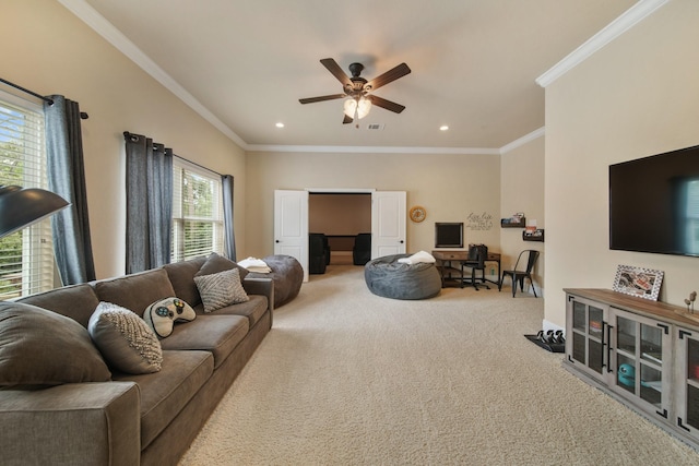 living room with carpet flooring, a ceiling fan, a desk, ornamental molding, and recessed lighting