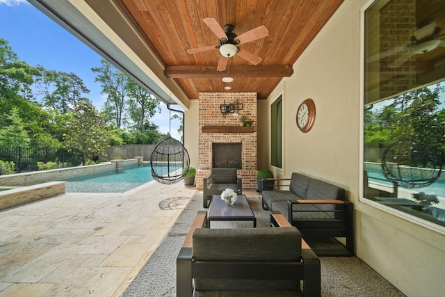 view of patio featuring an outdoor living space with a fireplace, a ceiling fan, and a fenced backyard