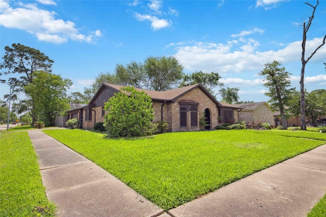 255 Shekel Ln, Houston, TX 77015 - ranch-style house featuring brick siding, a shingled roof, and a front yard