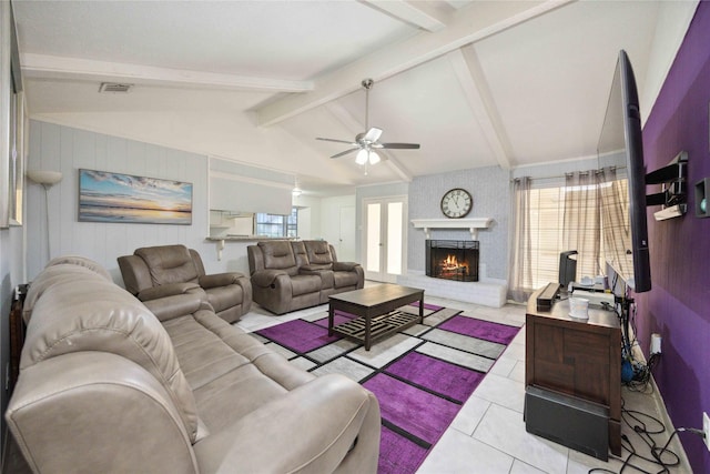255 Shekel Ln, Houston, TX 77015 - living room featuring ceiling fan, lofted ceiling with beams, a brick fireplace, and a wealth of natural light