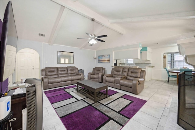 255 Shekel Ln, Houston, TX 77015 - living area with light tile patterned flooring, ceiling fan, visible vents, and vaulted ceiling with beams