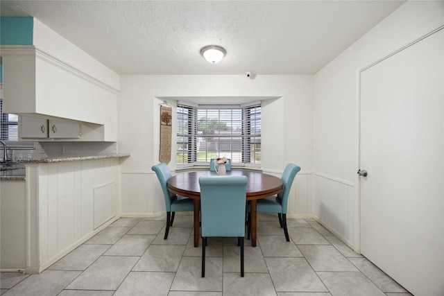 255 Shekel Ln, Houston, TX 77015 - dining area with a textured ceiling and light tile patterned floors