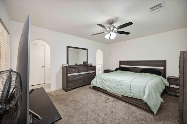 255 Shekel Ln, Houston, TX 77015 - carpeted bedroom with arched walkways, ceiling fan, and visible vents