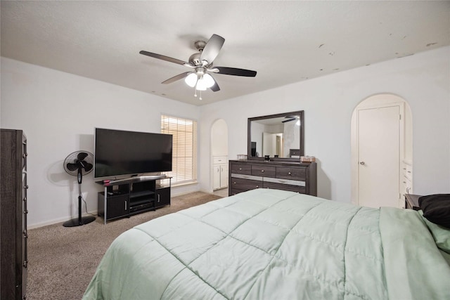 255 Shekel Ln, Houston, TX 77015 - carpeted bedroom featuring baseboards, arched walkways, and ceiling fan