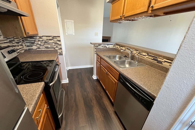 3600 Jeanetta St Unit 2502, Houston, TX 77063 - kitchen with appliances with stainless steel finishes, under cabinet range hood, a sink, baseboards, and dark wood-style flooring