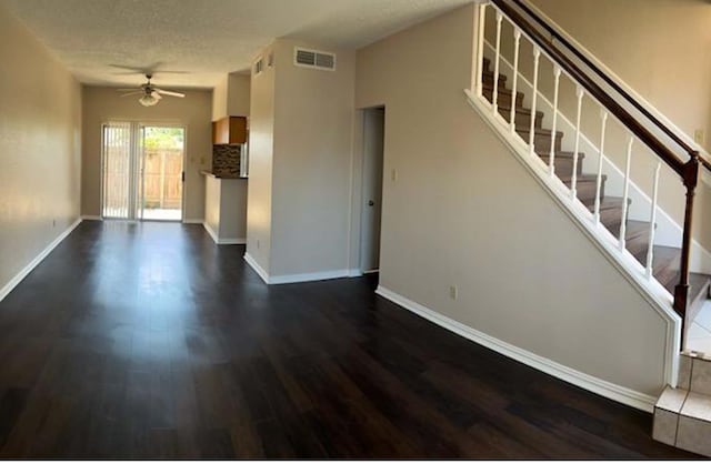 3600 Jeanetta St Unit 2502, Houston, TX 77063 - unfurnished living room featuring dark wood-style flooring, ceiling fan, baseboards, and stairs