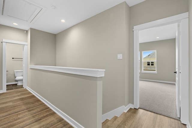 416 Stonework Landing Ln, Houston, TX 77076 - hall featuring attic access, recessed lighting, an upstairs landing, baseboards, and wood finished floors
