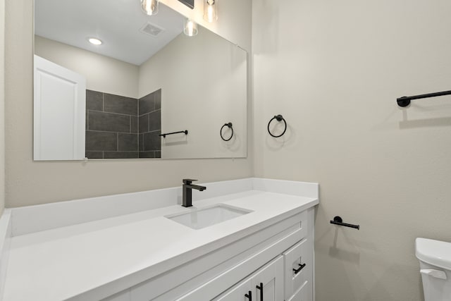 416 Stonework Landing Ln, Houston, TX 77076 - bathroom with toilet, visible vents, and vanity