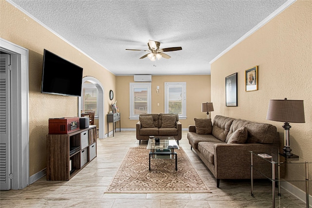 1101 Moody Ave, Galveston, TX 77550 - living area with a textured ceiling, ceiling fan, a textured wall, baseboards, and an AC wall unit