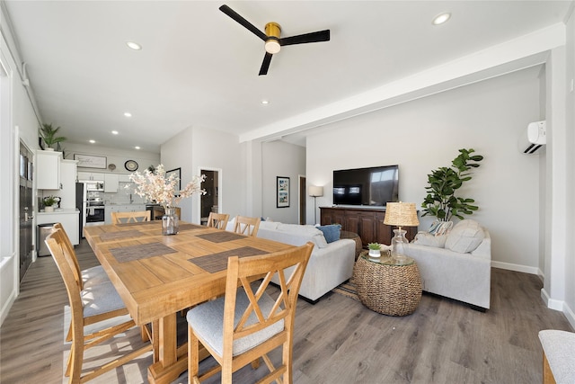 1101 Moody Ave, Galveston, TX 77550 - dining area featuring wood finished floors, ceiling fan, recessed lighting, and an AC wall unit