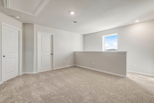carpeted spare room featuring attic access, visible vents, recessed lighting, and baseboards