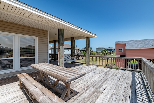 138 Verdia Dr, Crystal Beach, TX 77650 - wooden terrace featuring a residential view and outdoor dining area