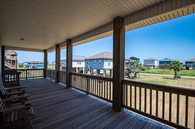 138 Verdia Dr, Crystal Beach, TX 77650 - wooden terrace with a lawn and a residential view