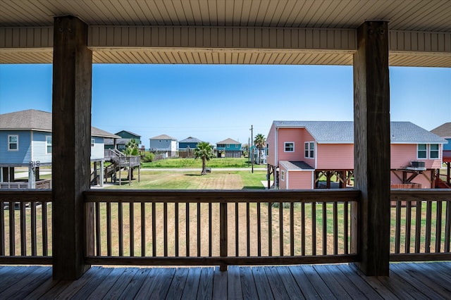 138 Verdia Dr, Crystal Beach, TX 77650 - wooden deck featuring a residential view and a lawn