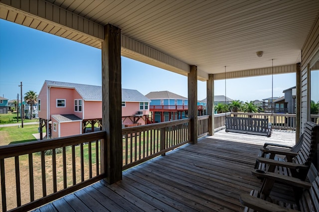 138 Verdia Dr, Crystal Beach, TX 77650 - wooden deck featuring a residential view and a lawn