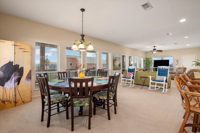 138 Verdia Dr, Crystal Beach, TX 77650 - dining area with light colored carpet, visible vents, and a wealth of natural light