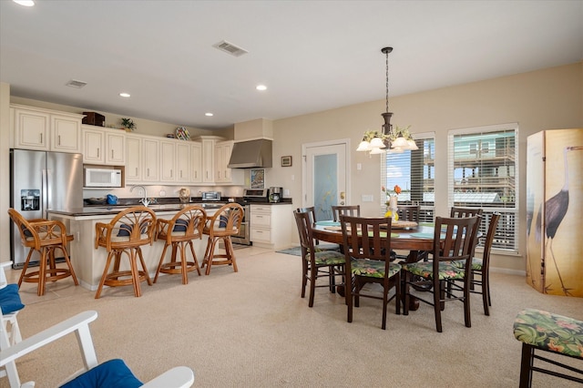 138 Verdia Dr, Crystal Beach, TX 77650 - dining room with an inviting chandelier, visible vents, recessed lighting, and light carpet