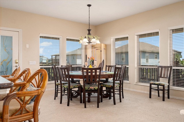 138 Verdia Dr, Crystal Beach, TX 77650 - dining area with an inviting chandelier, a wealth of natural light, and light carpet