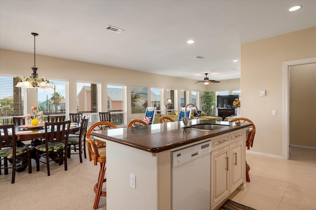 138 Verdia Dr, Crystal Beach, TX 77650 - kitchen featuring recessed lighting, white dishwasher, dark countertops, a sink, and visible vents