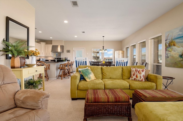 138 Verdia Dr, Crystal Beach, TX 77650 - living room featuring a notable chandelier, recessed lighting, visible vents, and light carpet
