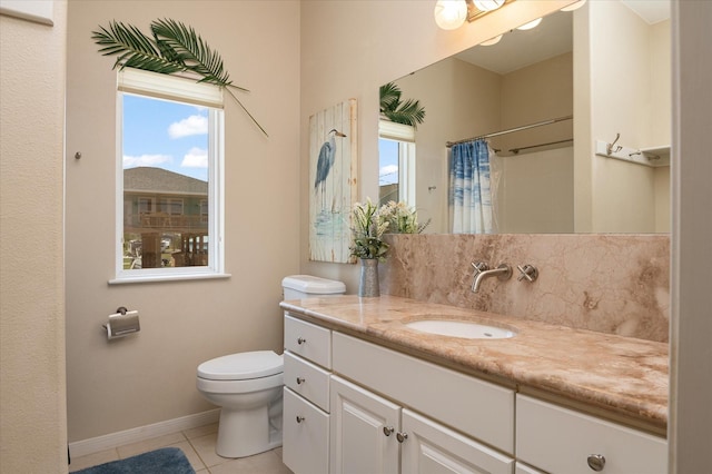 138 Verdia Dr, Crystal Beach, TX 77650 - full bath featuring vanity, tile patterned floors, toilet, baseboards, and a shower with shower curtain