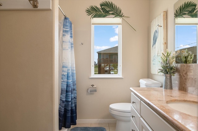138 Verdia Dr, Crystal Beach, TX 77650 - bathroom with plenty of natural light, toilet, tile patterned flooring, and vanity