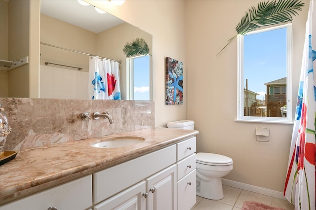 138 Verdia Dr, Crystal Beach, TX 77650 - bathroom featuring tile patterned flooring, backsplash, toilet, vanity, and baseboards