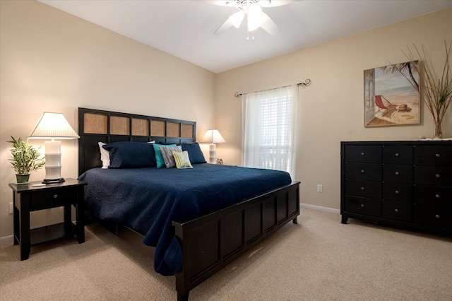 138 Verdia Dr, Crystal Beach, TX 77650 - bedroom featuring baseboards, a ceiling fan, and light carpet