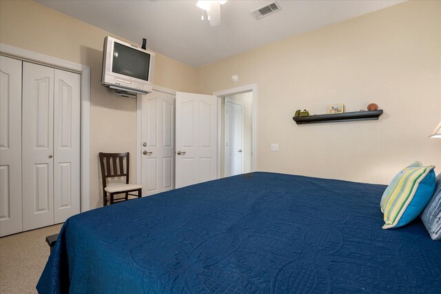 138 Verdia Dr, Crystal Beach, TX 77650 - carpeted bedroom with visible vents and ceiling fan