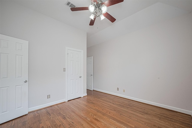 unfurnished bedroom featuring light wood finished floors, a ceiling fan, visible vents, and baseboards