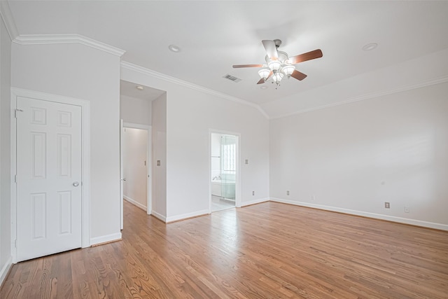 empty room with crown molding, ceiling fan, visible vents, baseboards, and light wood-type flooring