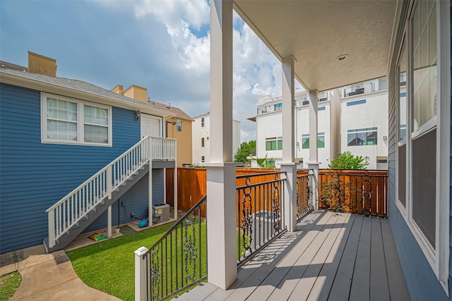 deck with a residential view, a lawn, stairs, and central AC unit