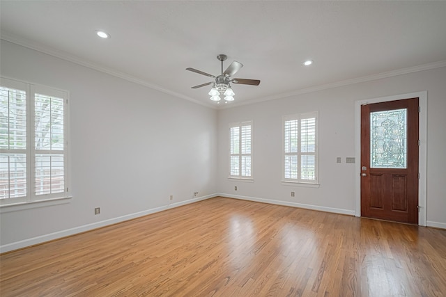 interior space featuring light wood-style floors, baseboards, recessed lighting, ornamental molding, and a ceiling fan