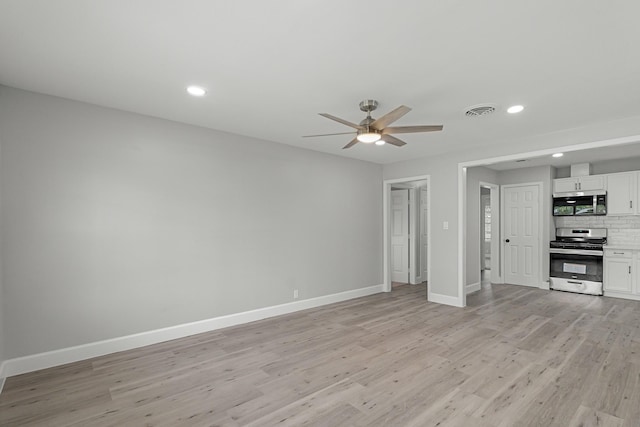 unfurnished living room featuring ceiling fan, visible vents, baseboards, recessed lighting, and light wood-style flooring