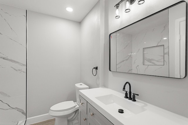 5429 De Lange Ln, Houston, TX 77092 - full bathroom with toilet, a marble finish shower, vanity, and wood finished floors