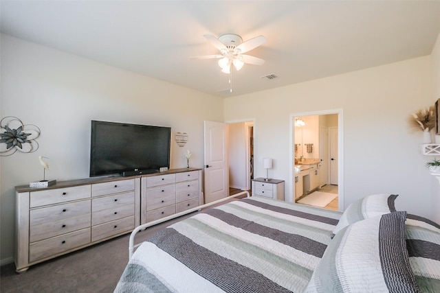 bedroom featuring visible vents, connected bathroom, a ceiling fan, and carpet floors