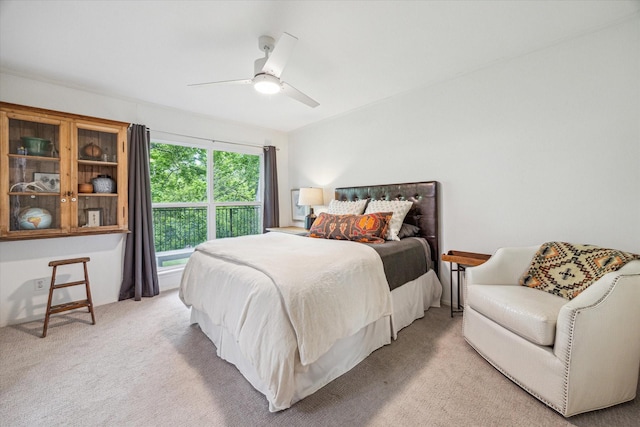 bedroom with light carpet and a ceiling fan