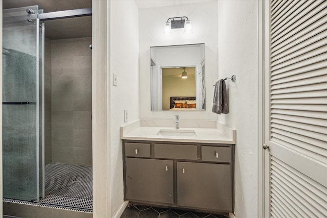 full bathroom featuring vanity, a shower stall, and tile patterned floors