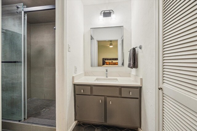 1800 Stoney Brook Dr Unit 105, Houston, TX 77063 - full bathroom featuring vanity, a shower stall, and tile patterned floors