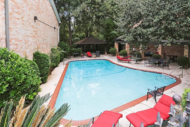 view of pool with a gazebo, a patio area, and a fenced in pool