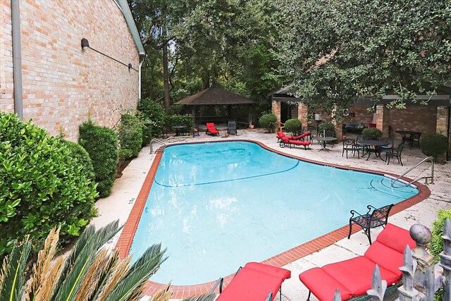 1800 Stoney Brook Dr Unit 105, Houston, TX 77063 - view of pool with a gazebo, a patio area, and a fenced in pool