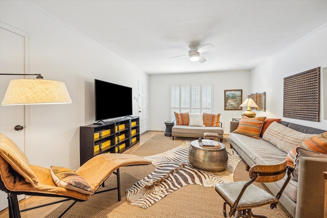 living area with ceiling fan and light colored carpet