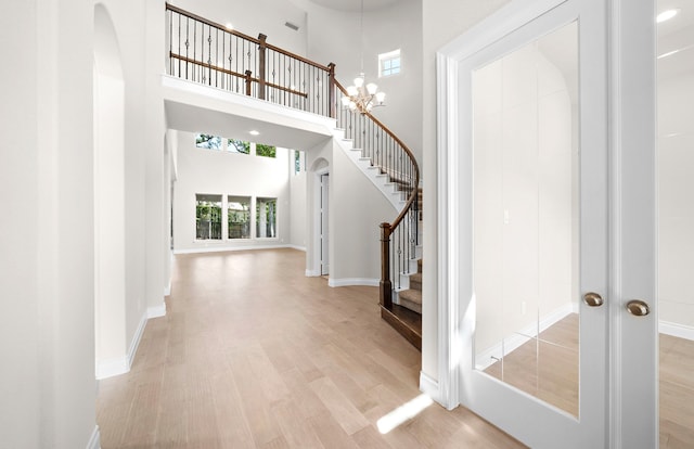 10719 Jacobina Ct, Cypress, TX 77433 - entrance foyer with a high ceiling, a wealth of natural light, and light wood-style floors