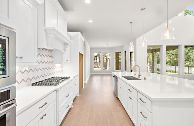 10719 Jacobina Ct, Cypress, TX 77433 - kitchen featuring recessed lighting, stainless steel appliances, light countertops, backsplash, and a sink