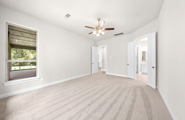 10719 Jacobina Ct, Cypress, TX 77433 - unfurnished bedroom with light colored carpet, visible vents, ensuite bath, and baseboards