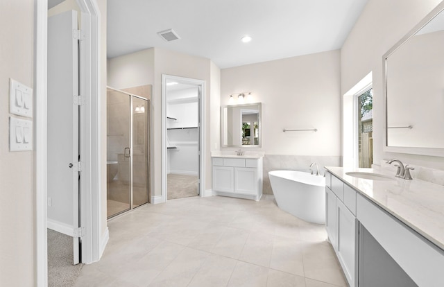 10719 Jacobina Ct, Cypress, TX 77433 - full bathroom featuring tile patterned flooring, a sink, a shower stall, and visible vents