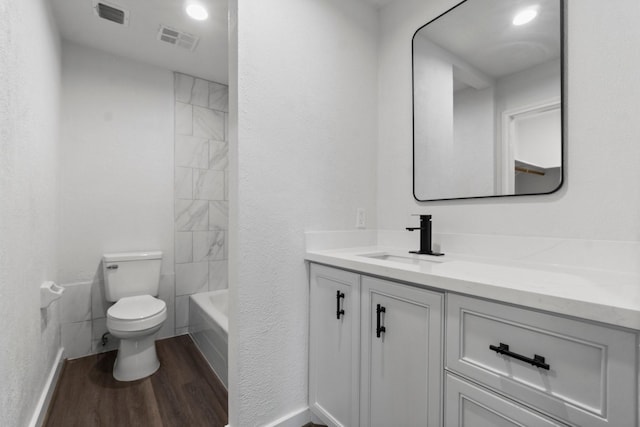 full bath featuring wood finished floors, visible vents, toilet, and vanity