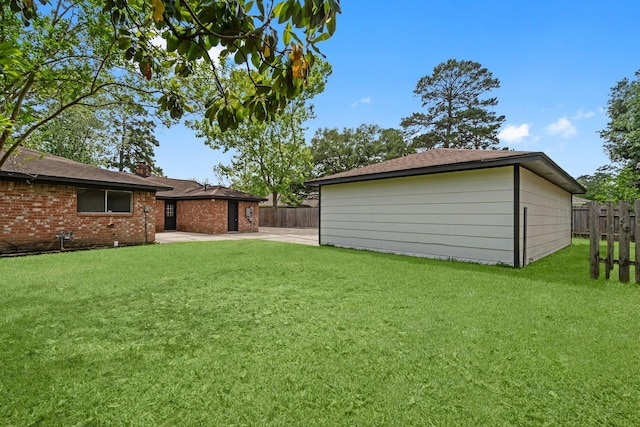 view of yard featuring a patio area and fence
