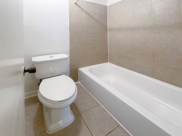 bathroom featuring tile patterned floors and toilet