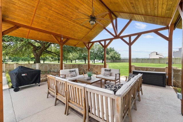 11008 Hillside Dr, Willis, TX 77318 - view of patio / terrace featuring a gazebo, grilling area, outdoor lounge area, a fenced backyard, and a ceiling fan